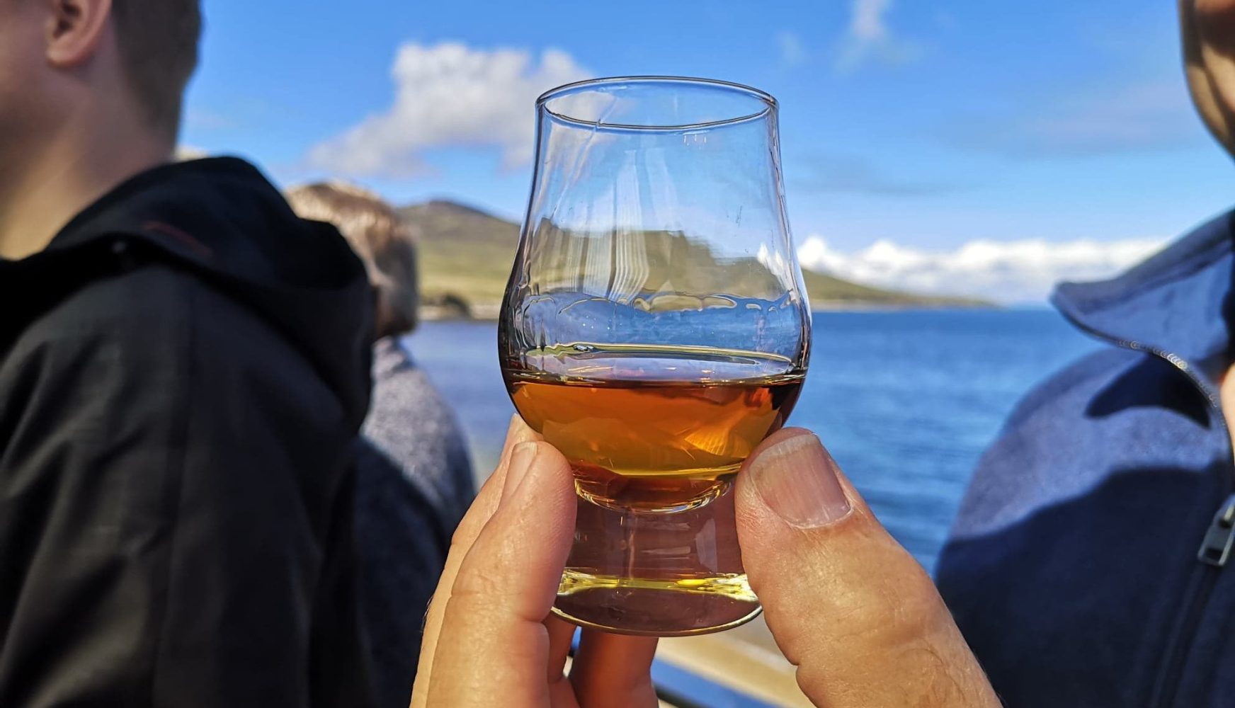 Man holding a whisky glass on our four day islay whisky tour!