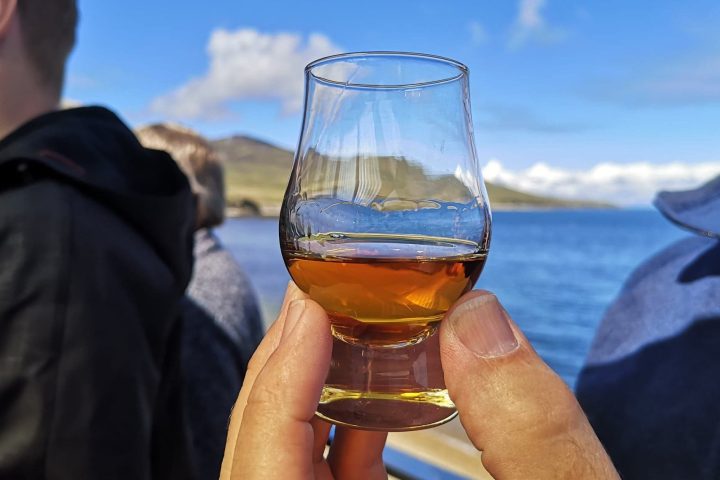 Man holding a whisky glass on our four day islay whisky tour!