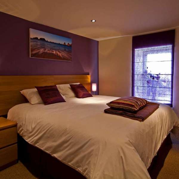 a bedroom with a bed in a hotel room