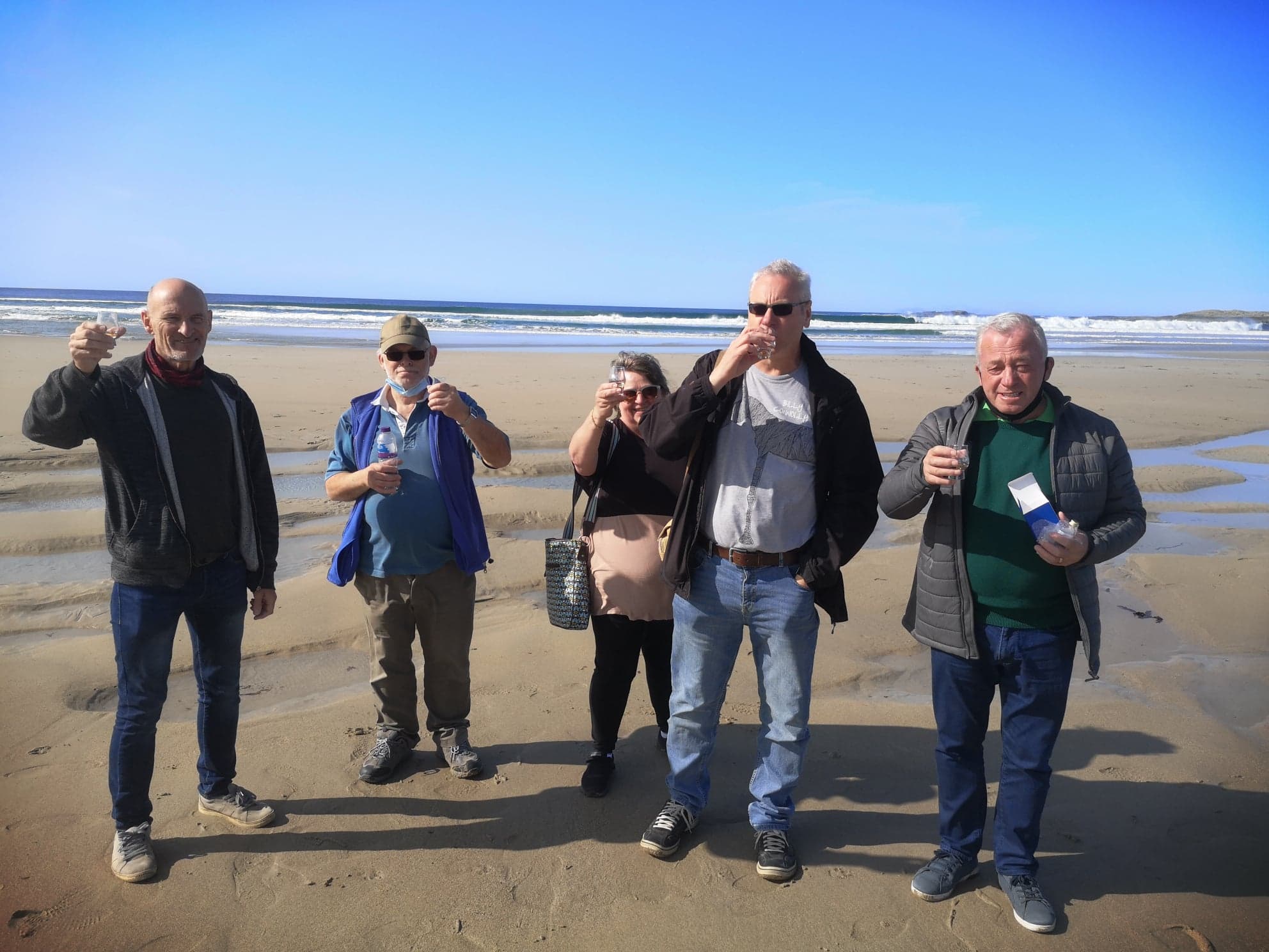a group of people standing on Machir Bay