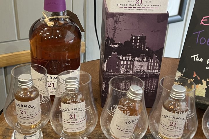 Tobermory 21-year whisky bottles and box displayed on a wooden surface.